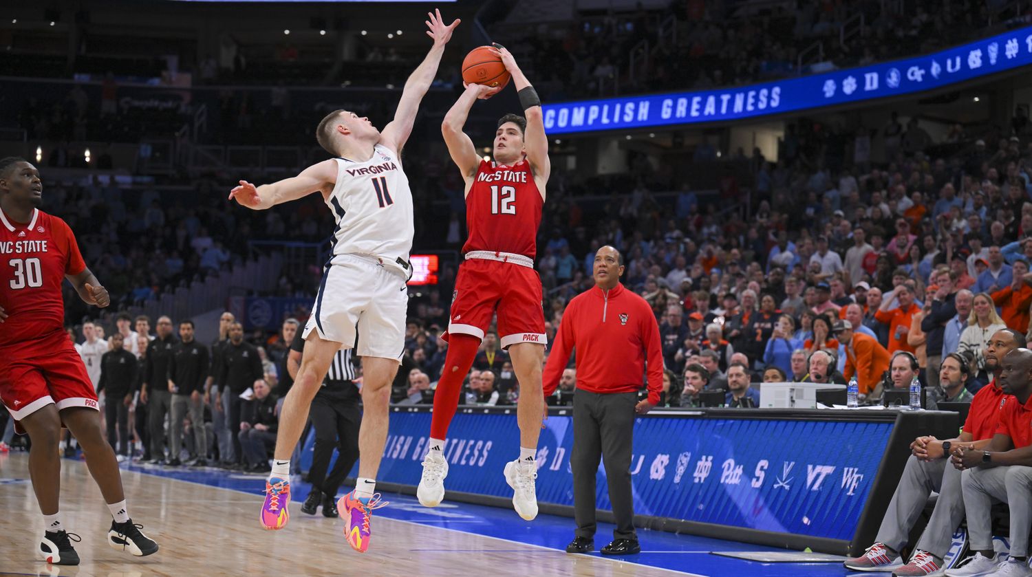 Michael O'Connell hits a buzzer-beating three-pointer over Isaac McKneely to tie the game at the end of regulation of the Virginia men's basketball game against NC State in the semifinals of the 2024 ACC Men's Basketball Tournament at Capital One Arena.